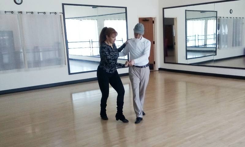 Student learning to dance with Jeanette